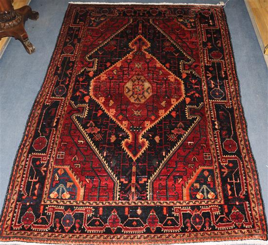 A Hamadan red and blue ground rug, 6ft 9in by 4ft 6in.